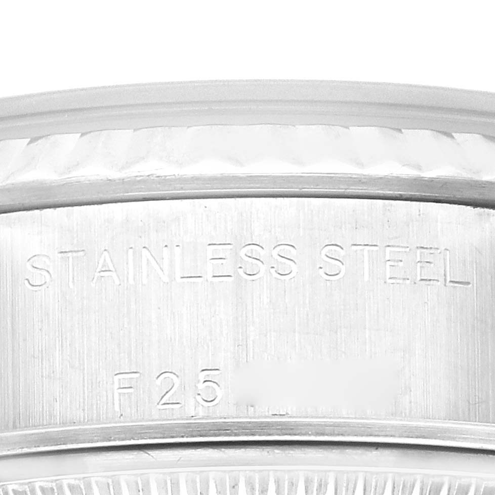 The image shows a close-up of the stainless steel casing and serial number on a Rolex Datejust 79174 Women's Stainless Steel Silver Dial 79174 Women's Stainless Steel Silver Dial model watch.