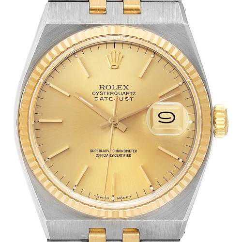 The image shows a Rolex Oysterquartz 17013 Men's Steel and Gold (two tone) Champagne Dial 17013 Men's Steel and Gold (two tone) Champagne Dial watch face with a gold dial, date window, and a gold and silver bezel and crown viewed from the front.