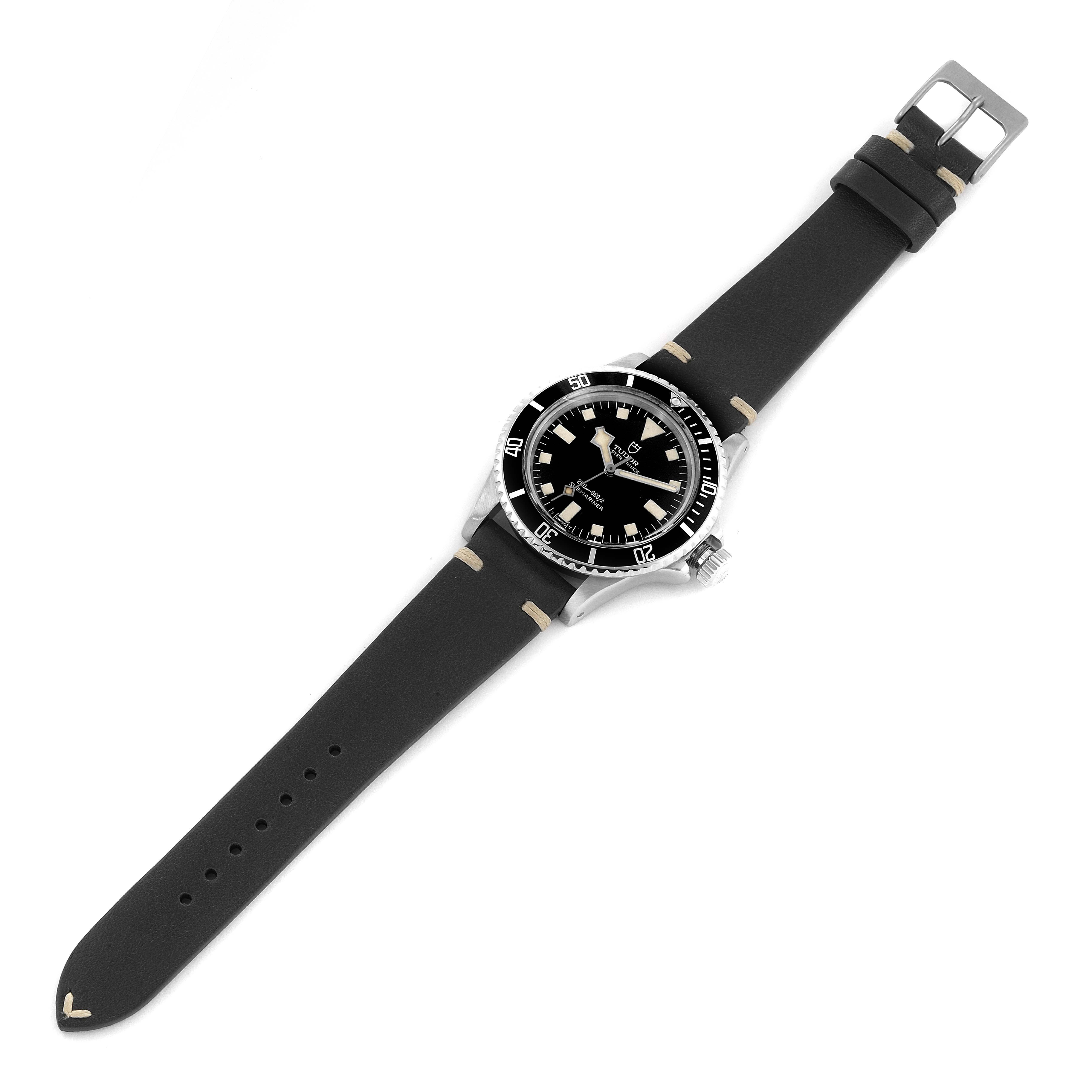 This image shows a Tudor Submariner 7016 Men's Stainless Steel Black Dial 7016 Men's Stainless Steel Black Dial watch viewed from a top-down angle on a black strap.