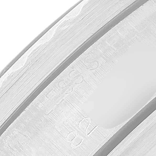 This close-up image shows a partial view of the case back and engravings of a Tudor Submariner 7016 Men's Stainless Steel Black Dial 7016 Men's Stainless Steel Black Dial watch.