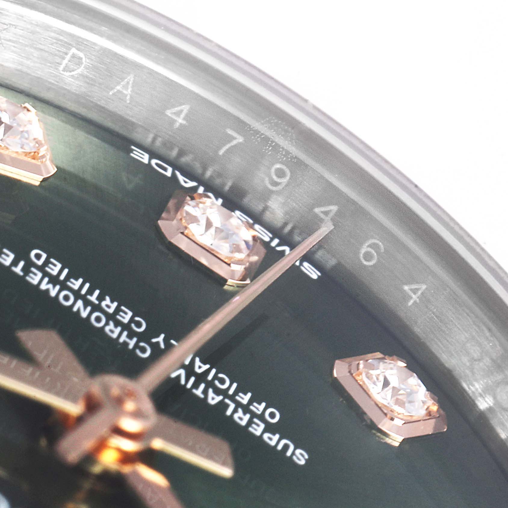 The image shows a close-up of the dial and serial number edge of a Rolex Datejust 279161 Women's Steel and Gold (two tone) Green Dial 279161 Women's Steel and Gold (two tone) Green Dial, highlighting the hour markers and text details.