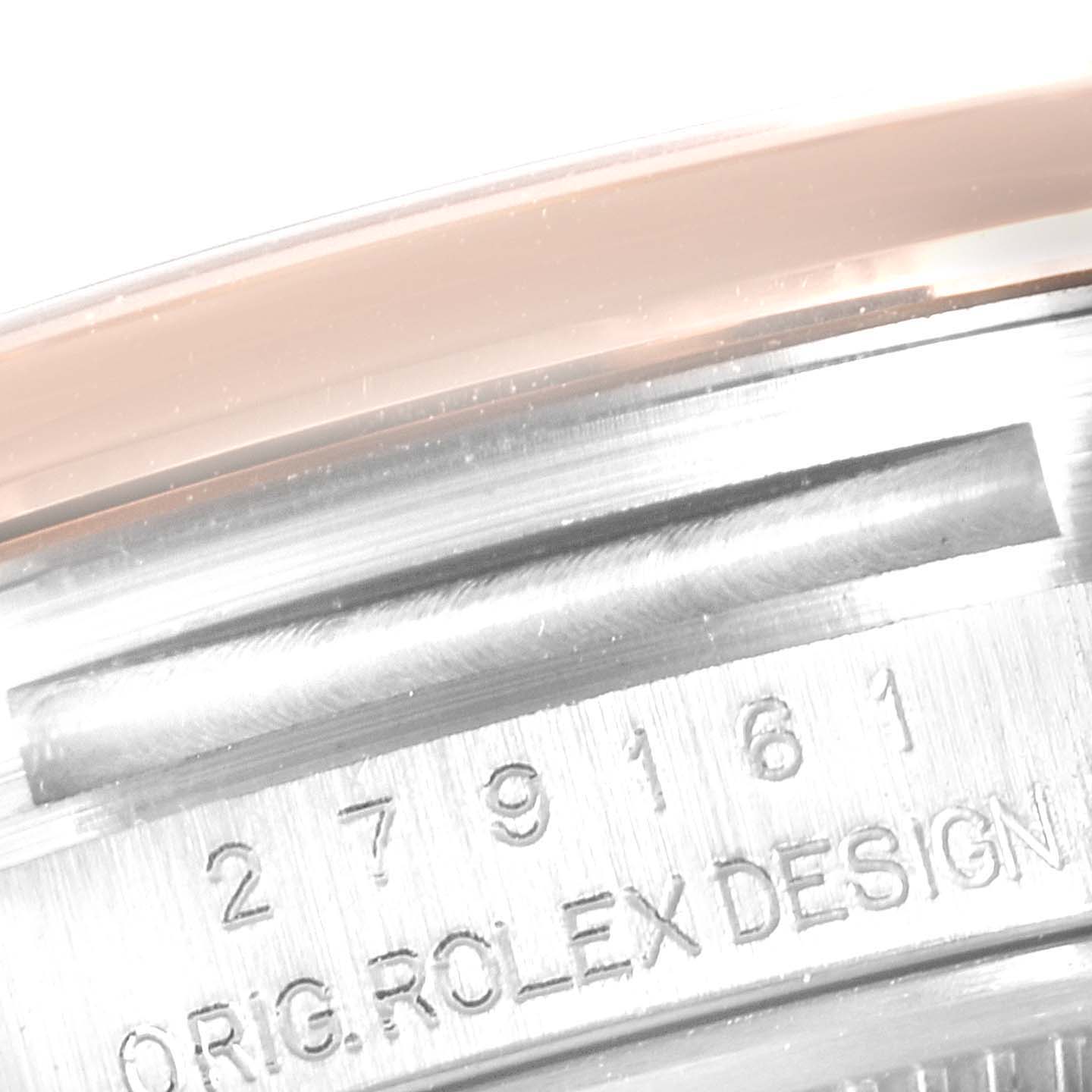 The image shows a close-up of the case side of a Rolex Datejust 279161 Women's Steel and Gold (two tone) Green Dial 279161 Women's Steel and Gold (two tone) Green Dial, highlighting the serial number and 'ORIG. ROLEX DESIGN' engraving.