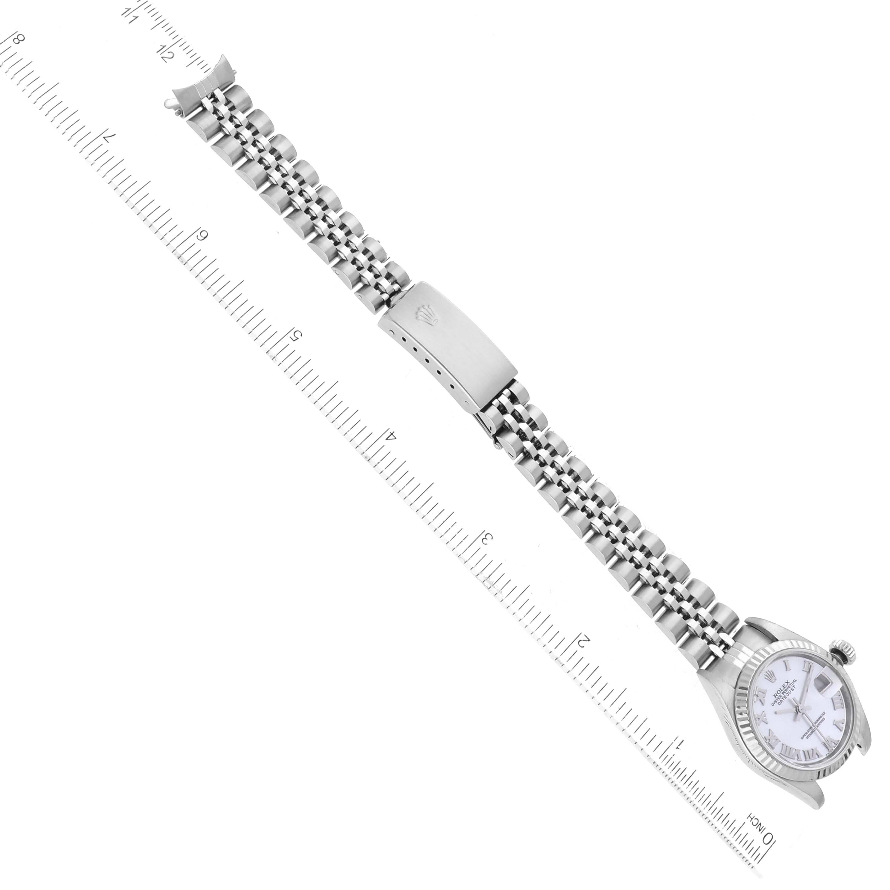 The image shows a Rolex Datejust 79174 Women's Stainless Steel Mother of Pearl Dial 79174 Women's Stainless Steel Mother of Pearl Dial watch laid flat and measured with a ruler, highlighting the face, bracelet, and clasp.