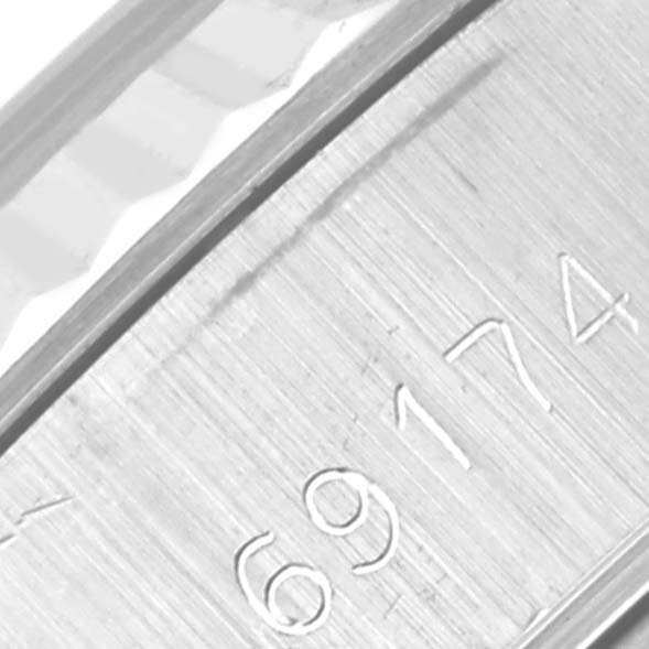 This close-up image shows the engraved model number of a Rolex Datejust 69174 Women's Stainless Steel Silver Dial 69174 Women's Stainless Steel Silver Dial watch.