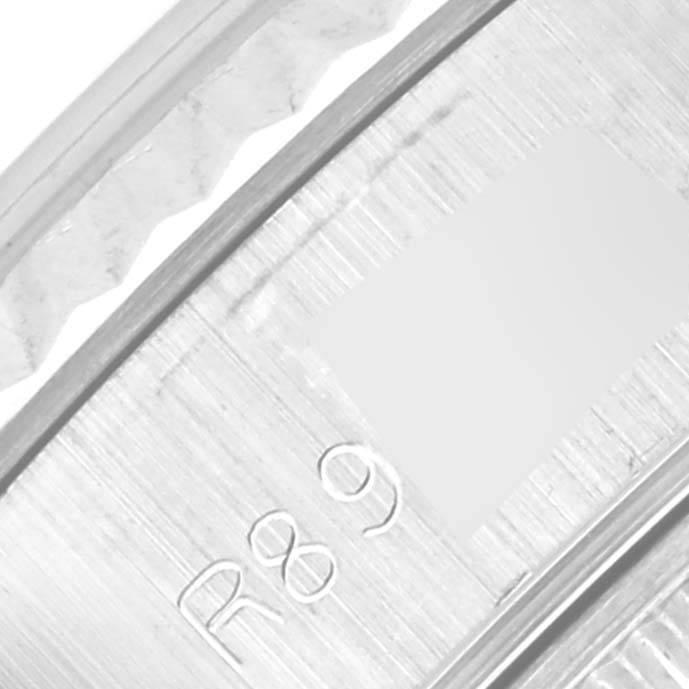 This is a close-up of the Rolex Datejust 69174 Women's Stainless Steel Silver Dial 69174 Women's Stainless Steel Silver Dial model's inner bezel with engraved markings.