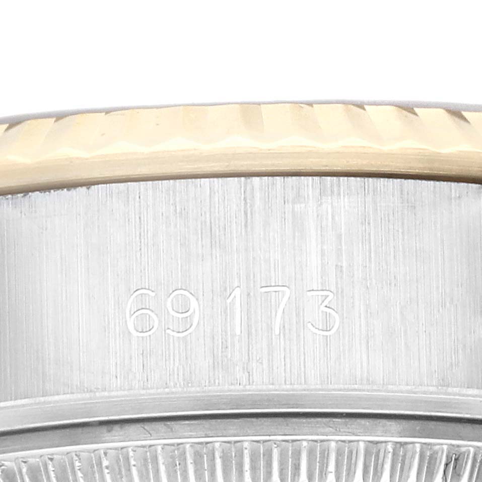 The image shows the model number engraving on the side of the case of a Rolex Datejust 69173G Women's Steel and Gold (two tone) Champagne Dial 69173G Women's Steel and Gold (two tone) Champagne Dial watch, near the bezel.