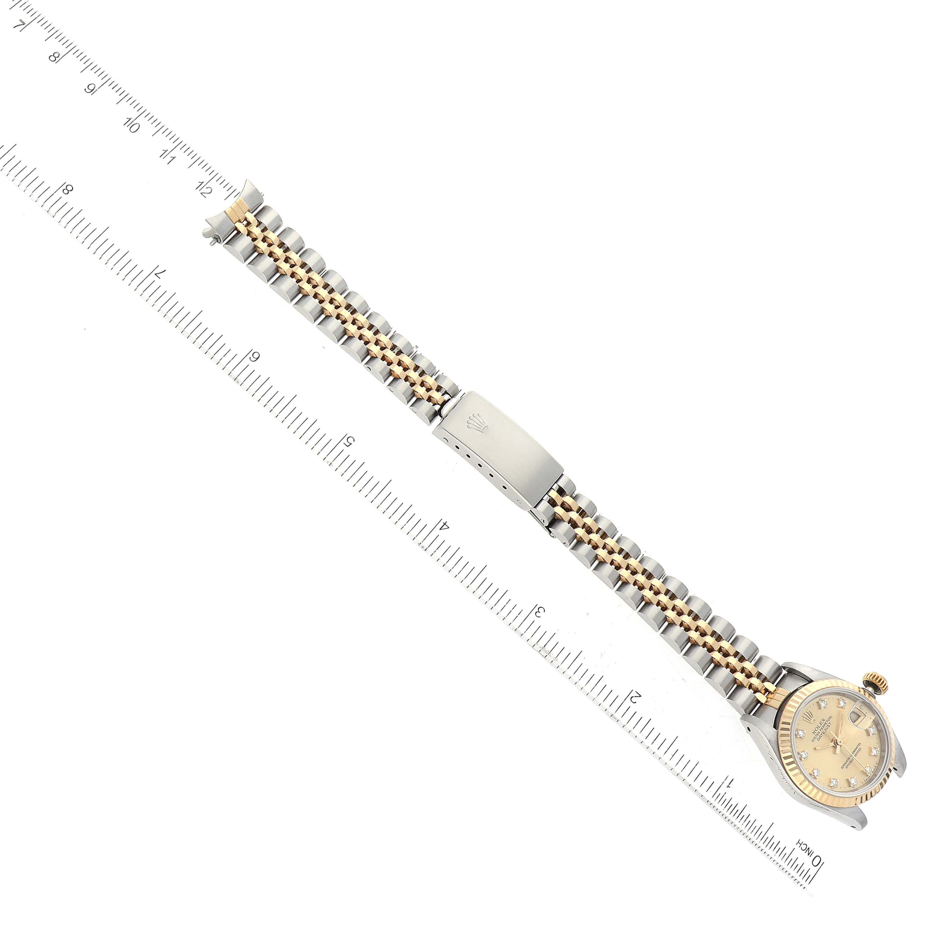 The image shows a Rolex Datejust 69173G Women's Steel and Gold (two tone) Champagne Dial 69173G Women's Steel and Gold (two tone) Champagne Dial watch, focusing on the full length of its two-tone bracelet and part of the dial, aligned with a ruler.