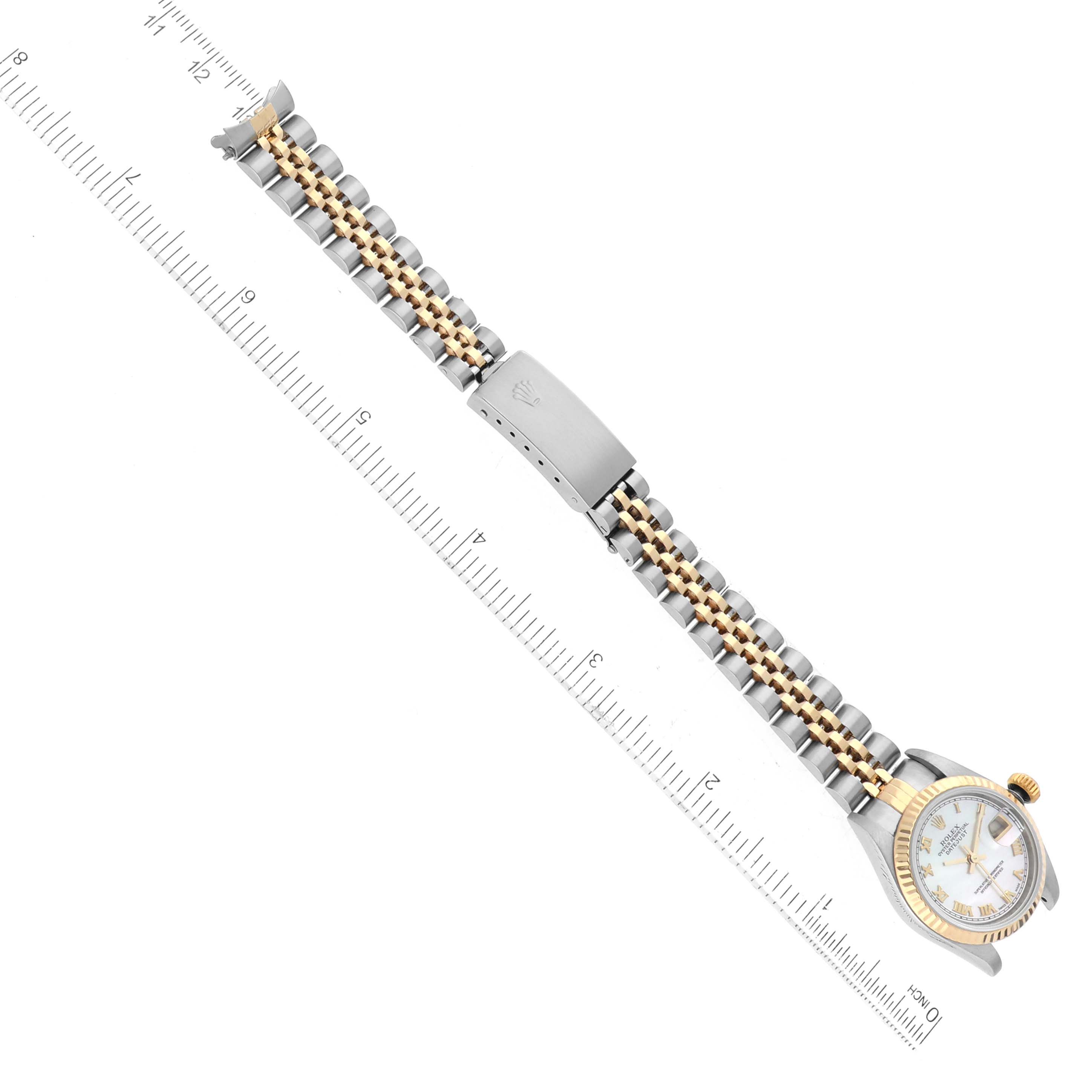 The Rolex Datejust 79173 Women's Steel and Gold (two tone) Mother of Pearl Dial 79173 Women's Steel and Gold (two tone) Mother of Pearl Dial watch is shown from a top-down angle, including the bracelet, clasp, and part of the dial.