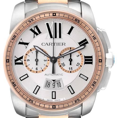 The image shows a front view of a Calibre de Cartier watch with its dial, bezel, and part of the bracelet visible.