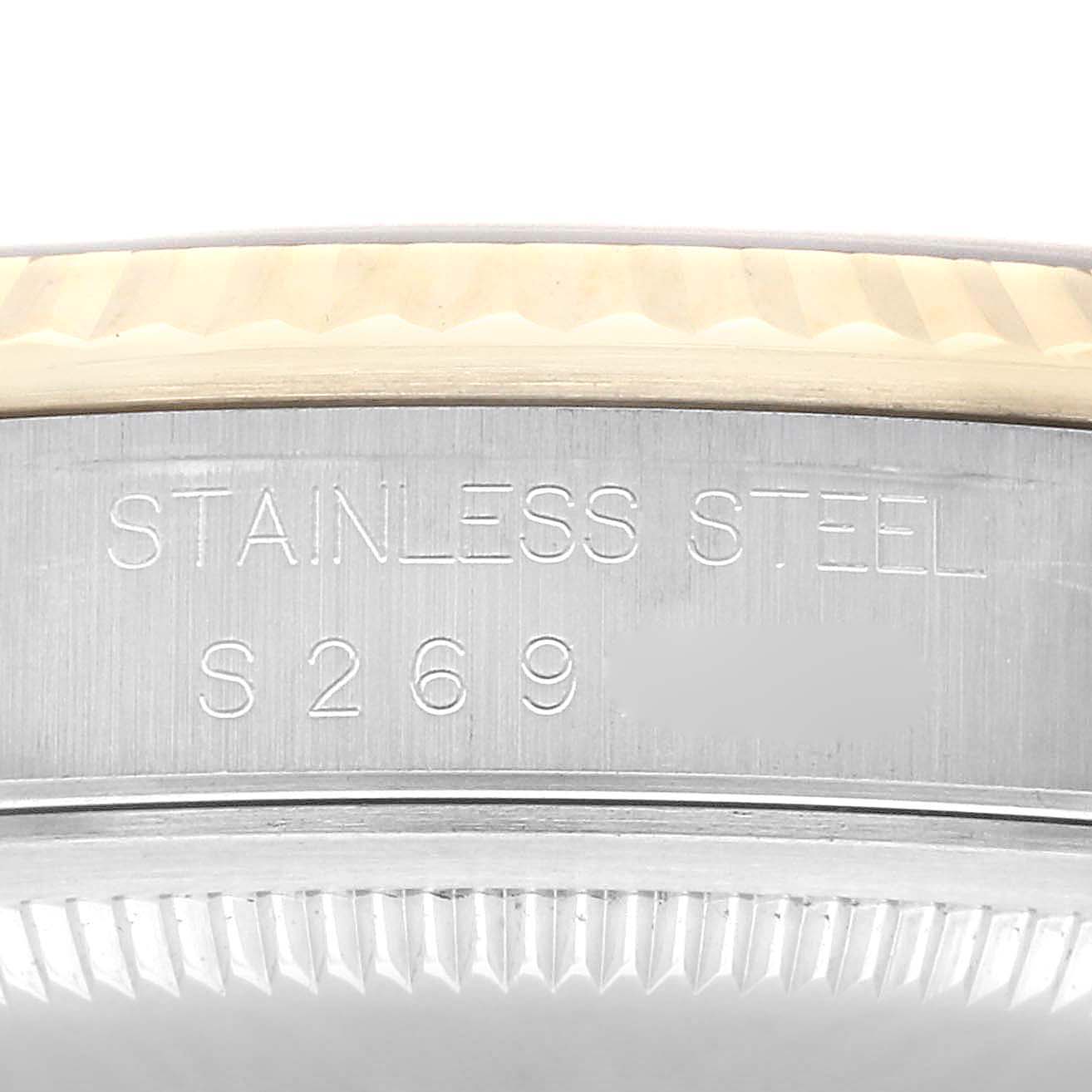 The image shows a close-up of the side of the case for a Rolex Datejust 16233 Men's Steel and Gold (two tone) Black Dial 16233 Men's Steel and Gold (two tone) Black Dial, highlighting the "STAINLESS STEEL" engraving.