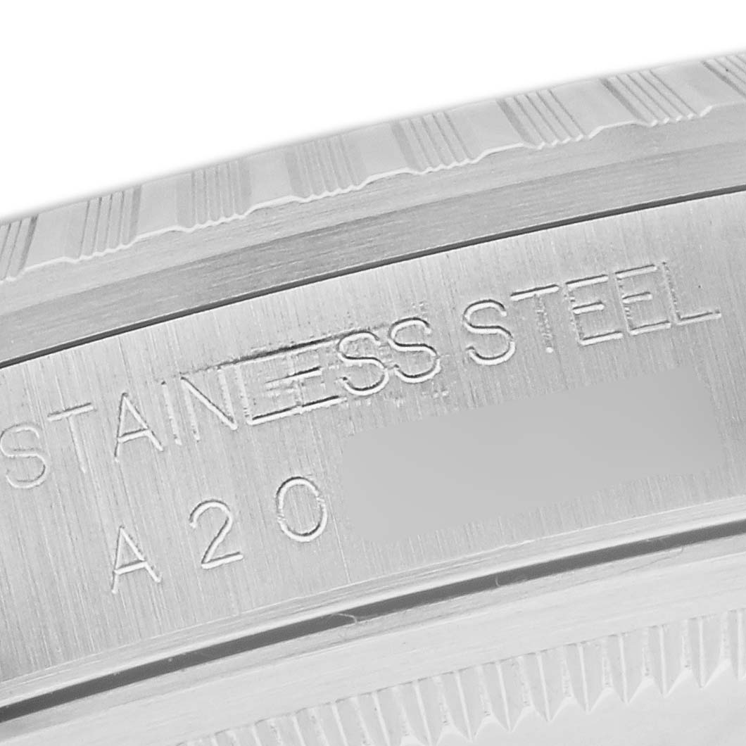 The image shows a close-up of the case back engraving on a Rolex Datejust 16220 Men's Stainless Steel Silver Dial 16220 Men's Stainless Steel Silver Dial watch, highlighting the "STAINLESS STEEL" text.