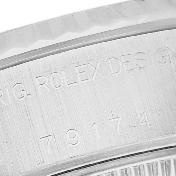 The image shows a close-up of the serial number and "ORIG. ROLEX DESIGN" engraving on the case of a Rolex Datejust 79174 Women's Stainless Steel Mother of Pearl Dial 79174 Women's Stainless Steel Mother of Pearl Dial watch.
