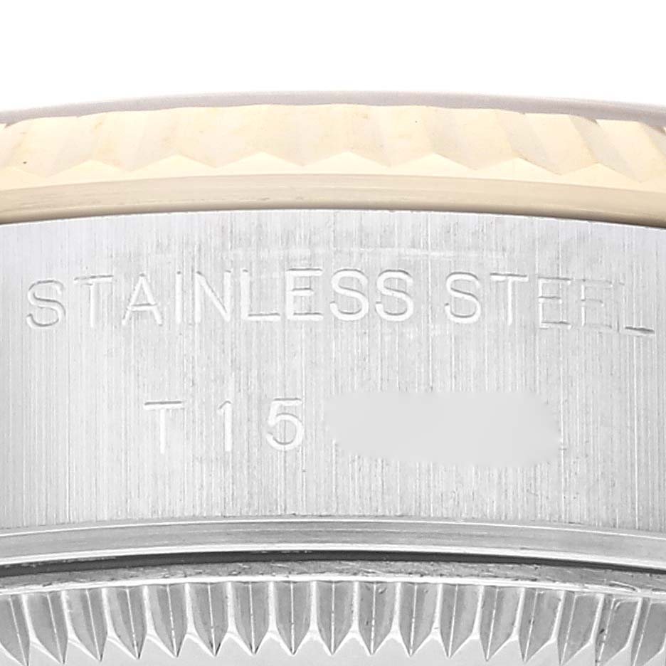 This close-up image shows the bezel and part of the case back with engravings on a Rolex Datejust 69173G Women's Steel and Gold (two tone) Champagne Dial 69173G Women's Steel and Gold (two tone) Champagne Dial watch.