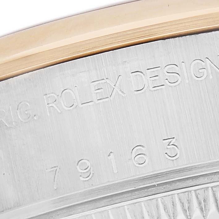 The image shows a close-up of the engraved case back of a Rolex Datejust 79163 Women's Steel and Gold (two tone) Mother of Pearl Dial 79163 Women's Steel and Gold (two tone) Mother of Pearl Dial watch, highlighting the model number.