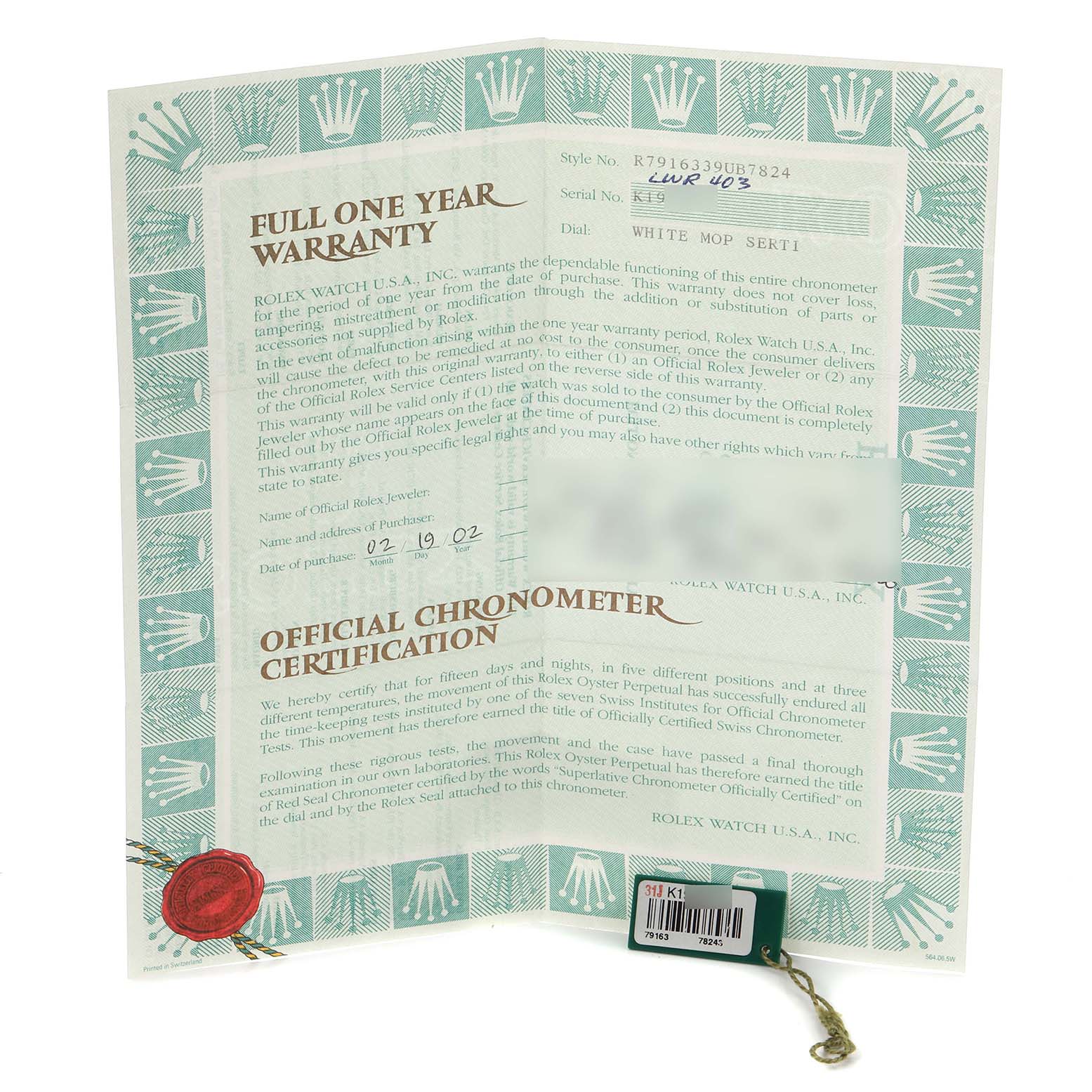 The image shows a Rolex Datejust 79163 Women's Steel and Gold (two tone) Mother of Pearl Dial 79163 Women's Steel and Gold (two tone) Mother of Pearl Dial watch warranty card and chronometer certification held upright, displaying text and logos.