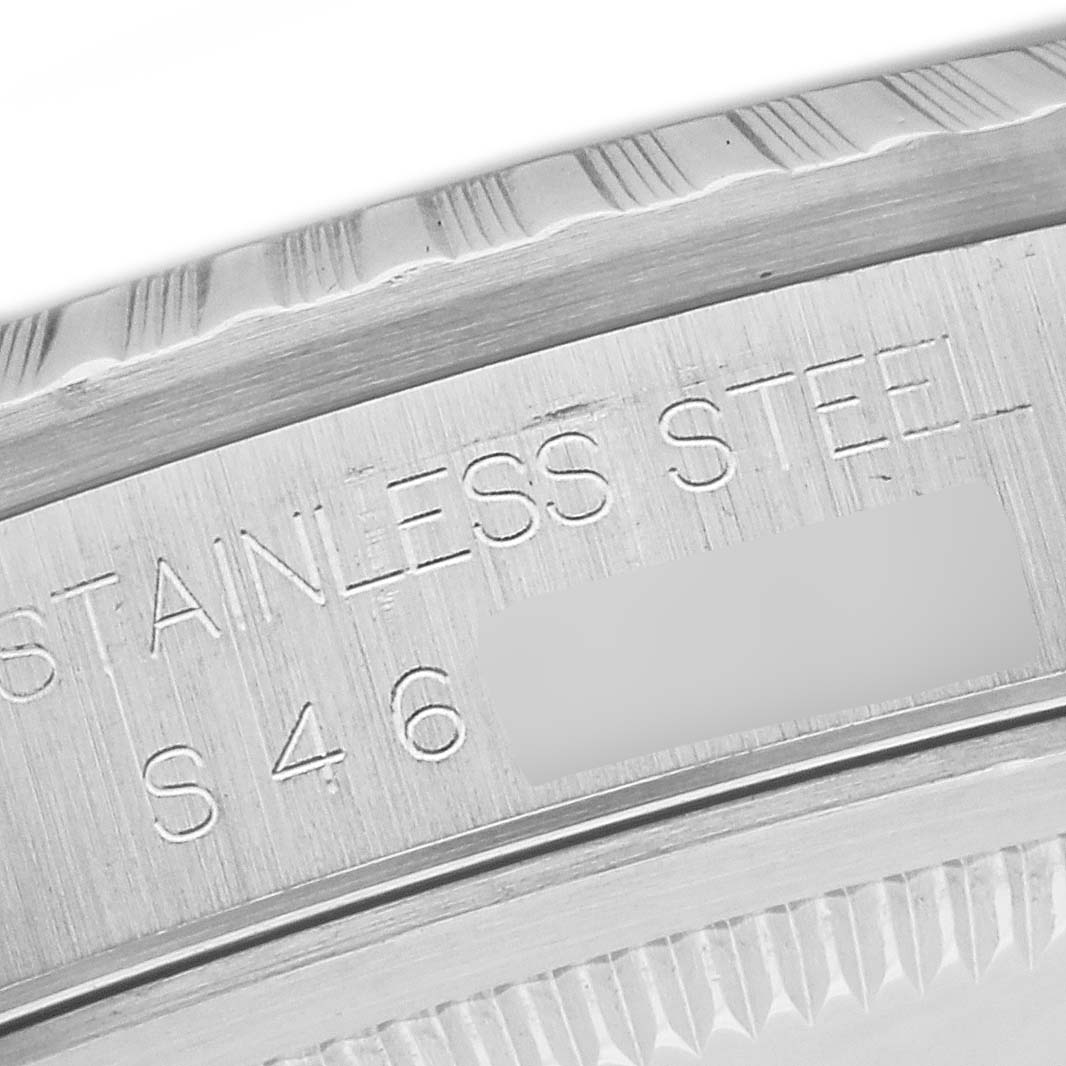 A close-up view of the case side engraving of a Rolex Datejust 16220 Men's Stainless Steel White Dial 16220 Men's Stainless Steel White Dial, showing the word "STAINLESS STEEL" and fluted bezel details.