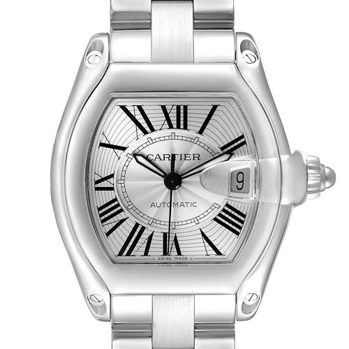 The Cartier Roadster W62025V3 men's watch is shown from a front angle, highlighting its silver dial, Roman numerals, date window, and metal bracelet.