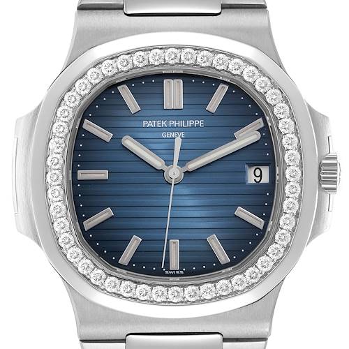 The image shows a frontal view of the Patek Philippe Nautilus model 5713 men's watch, featuring its blue dial, diamond bezel, and date window.