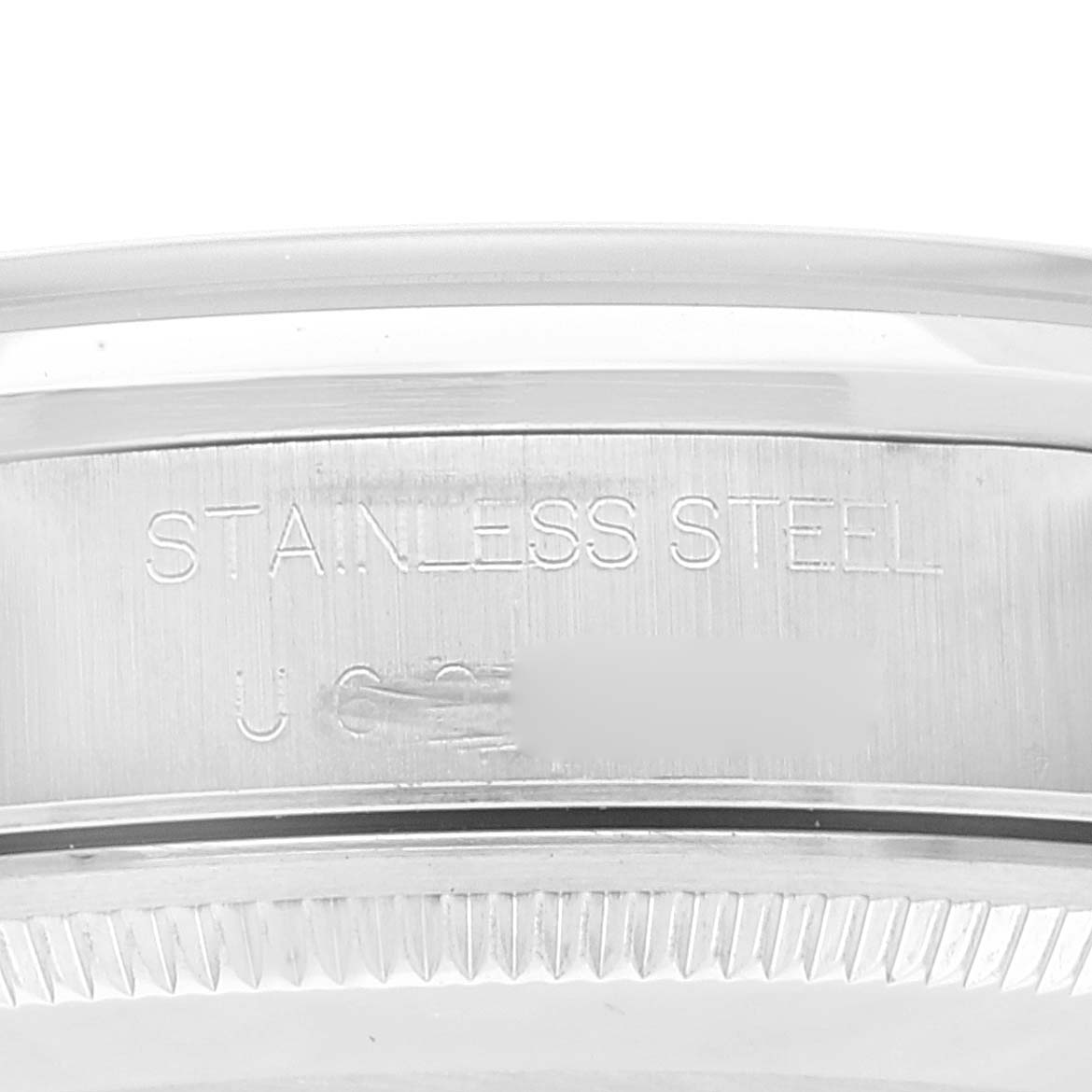 This image shows a close-up of the stainless steel case back of the Rolex Air-King 14000 Men's Stainless Steel Blue Dial 14000 Men's Stainless Steel Blue Dial watch.