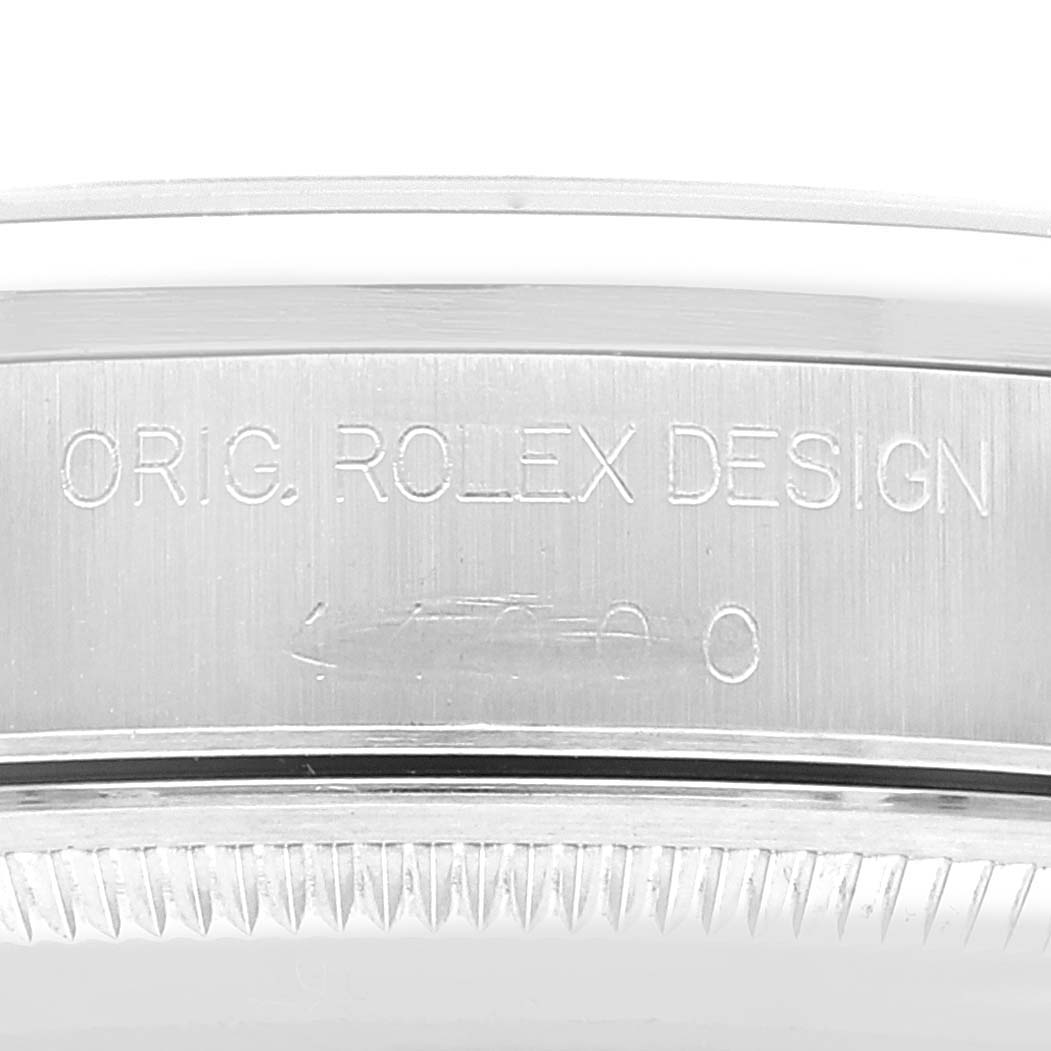 The image shows an engraved side view of the bezel of a Rolex Air-King 14000 Men's Stainless Steel Blue Dial 14000 Men's Stainless Steel Blue Dial watch with the text "ORIG. ROLEX DESIGN."