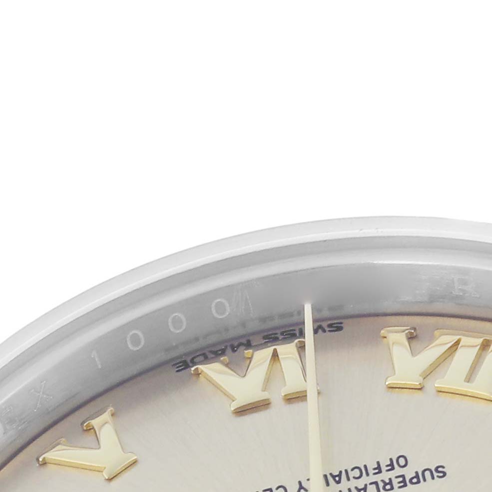 The image shows a close-up detail of the Rolex Datejust model 279173, focusing on the watch's dial with gold Roman numerals and part of the bezel.