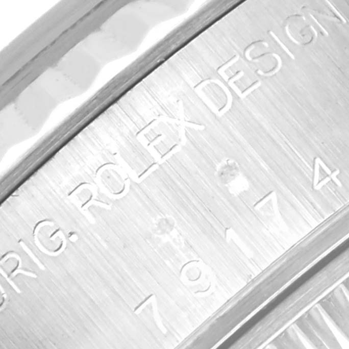 The image shows a close-up of the engraved text on the Rolex Datejust 79174 Women's Stainless Steel Mother of Pearl Dial 79174 Women's Stainless Steel Mother of Pearl Dial watch's inner case.