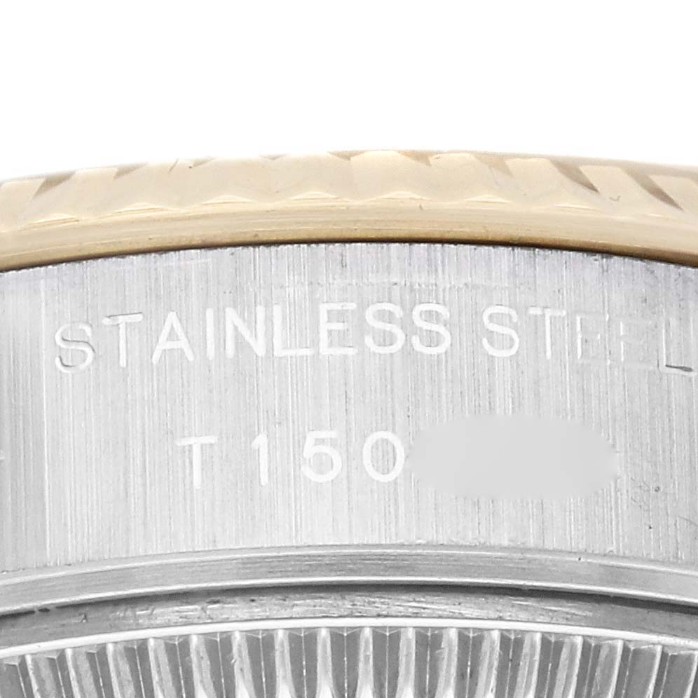 This image shows a close-up side view of the stainless steel bezel and part of the casing of a Rolex Datejust 69173 Women's Steel and Gold (two tone) Champagne Dial 69173 Women's Steel and Gold (two tone) Champagne Dial model.