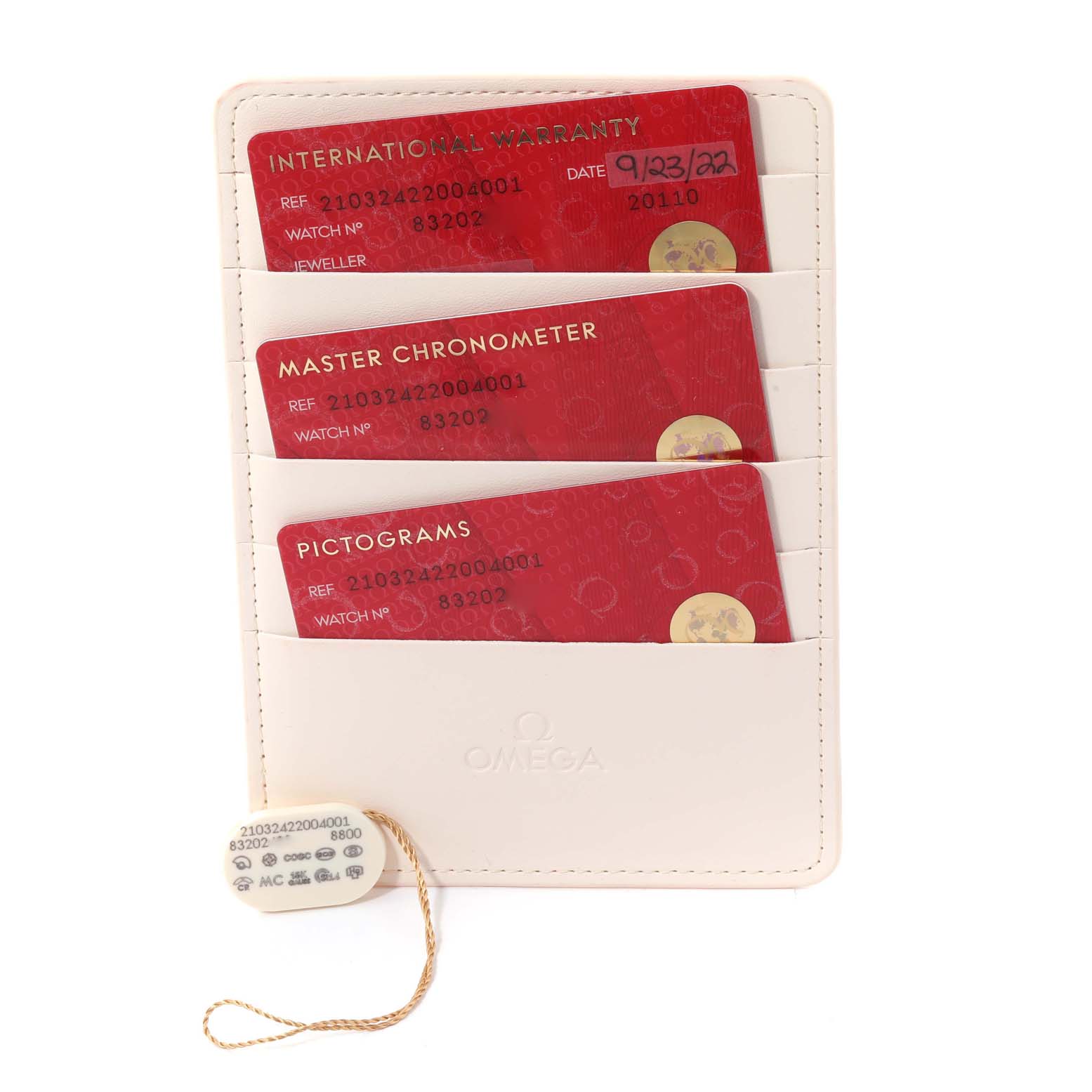 This image shows the warranty cards and accessories for an Omega Seamaster 210.32.42.20.04.001 Men's Stainless Steel White Dial 210.32.42.20.04.001 Men's Stainless Steel White Dial watch, neatly arranged in a holder.