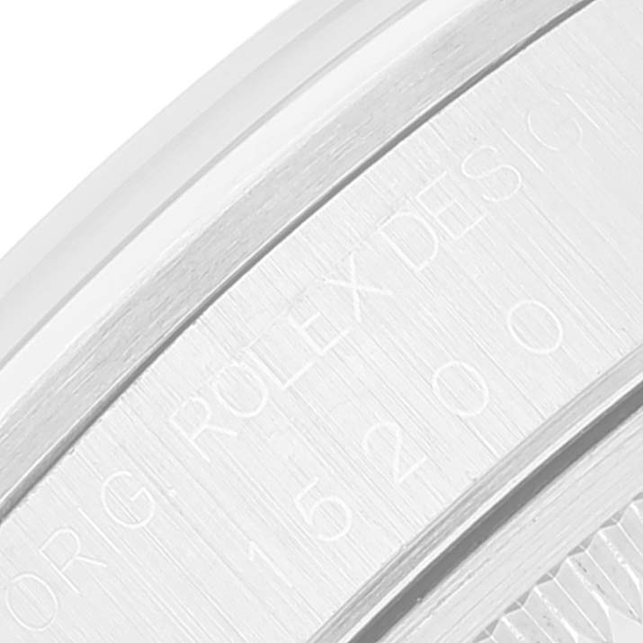 This image shows an angled close-up of the serial number and engravings on the caseback of a Rolex Date 15200 Men's Stainless Steel White Dial 15200 Men's Stainless Steel White Dial model watch.