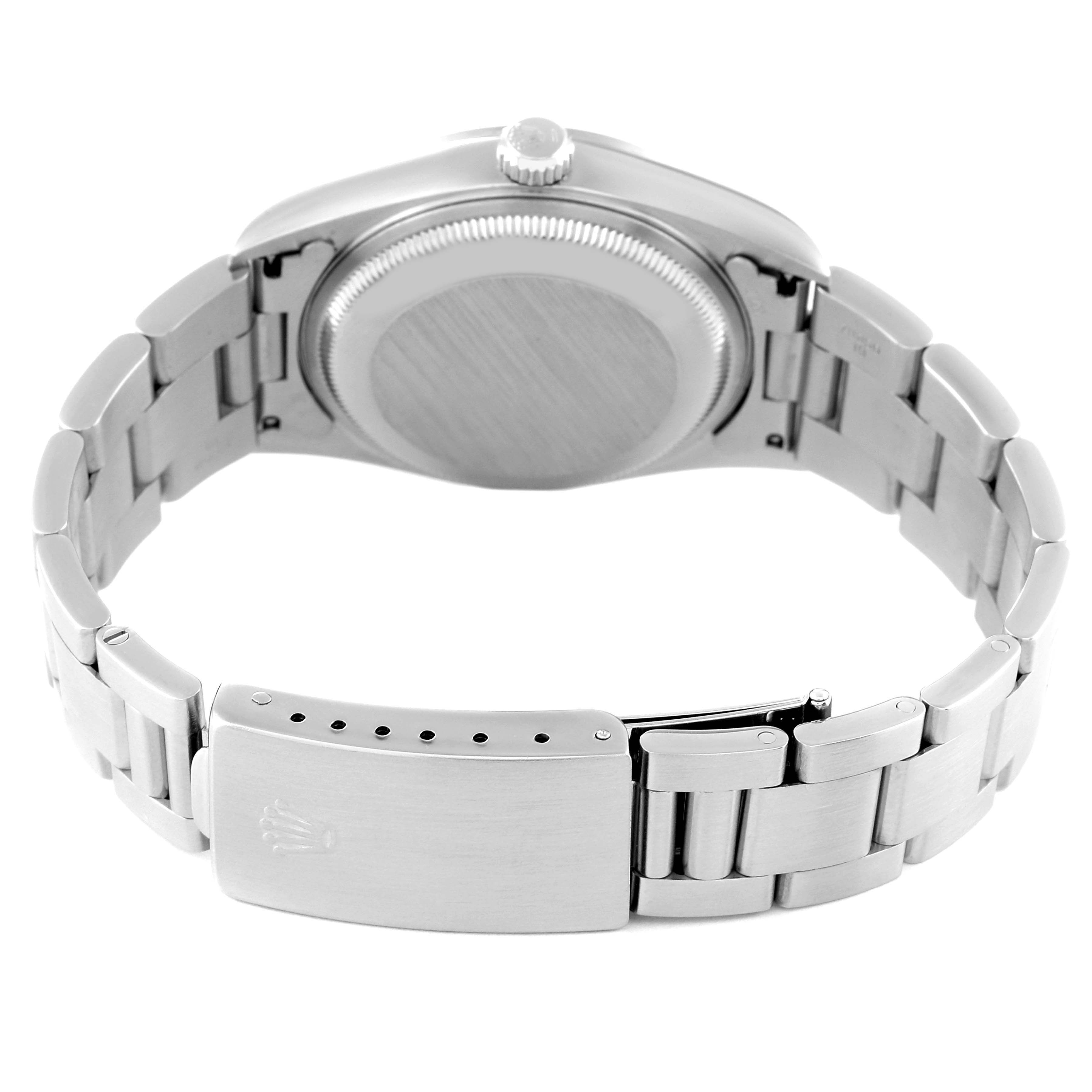 This image shows the back view of a Rolex Date 15200 Men's Stainless Steel White Dial 15200 Men's Stainless Steel White Dial watch, focusing on the case back, crown, and the metallic bracelet with the clasp.