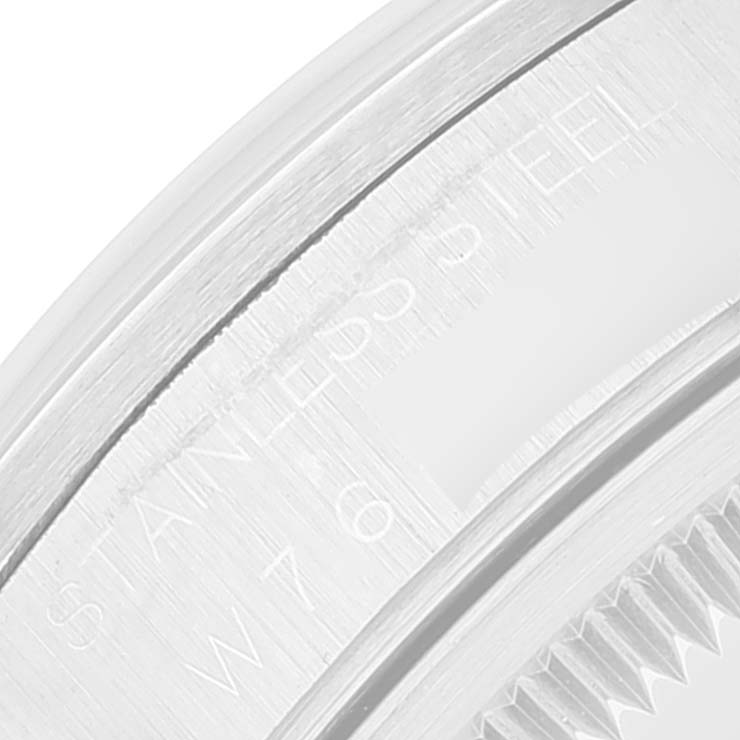 This image shows an extreme close-up of the stainless steel edge and markings on a Rolex Date 15200 Men's Stainless Steel White Dial 15200 Men's Stainless Steel White Dial model watch.