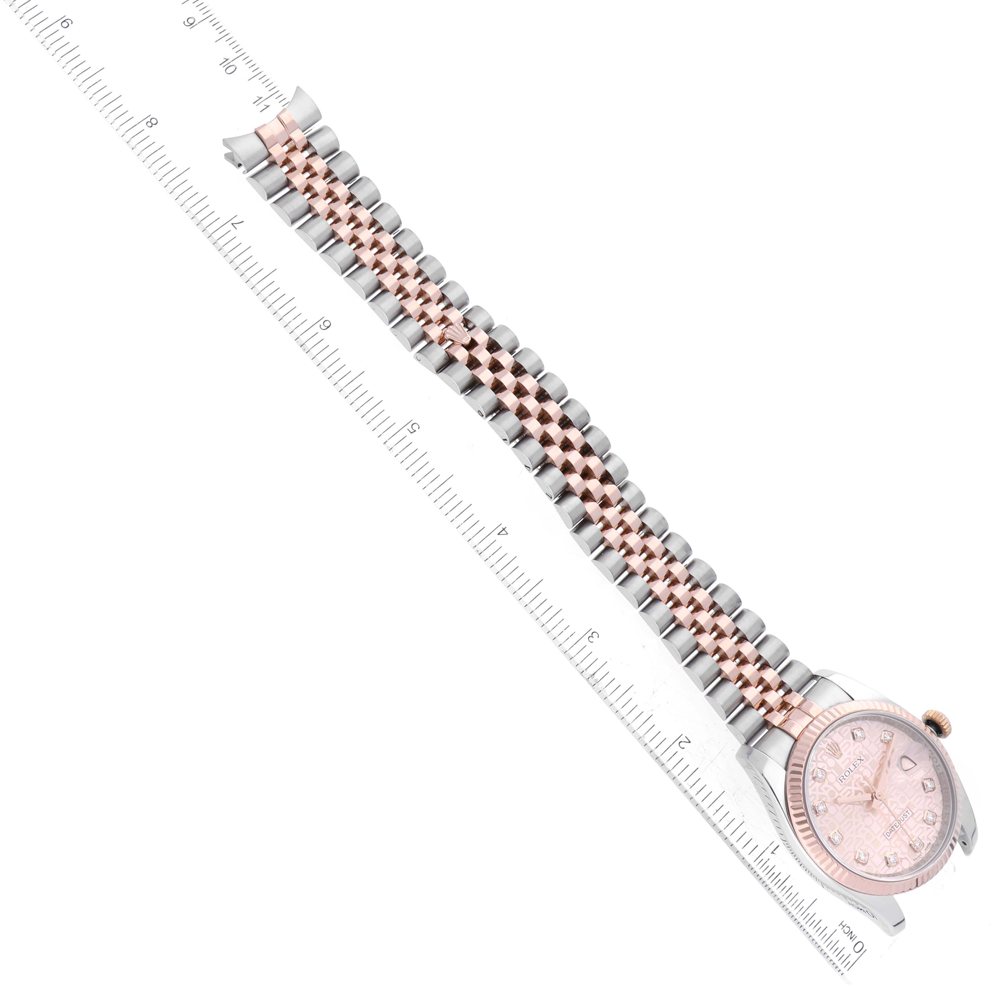 The image shows a Rolex Datejust 116231 Men's Steel and Gold (two tone) Pink Dial 116231 Men's Steel and Gold (two tone) Pink Dial watch at an oblique angle, featuring the dial and the two-tone bracelet laid alongside a ruler.