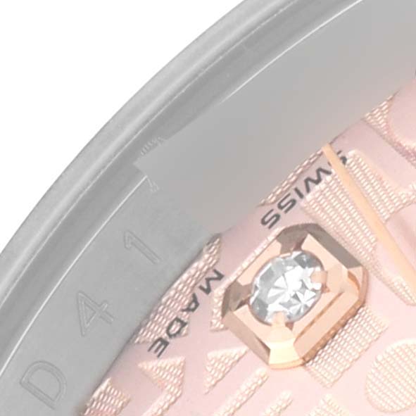 The image shows a close-up of the dial and bezel of a Rolex Datejust 116231 Men's Steel and Gold (two tone) Pink Dial 116231 Men's Steel and Gold (two tone) Pink Dial watch, highlighting a diamond hour marker.