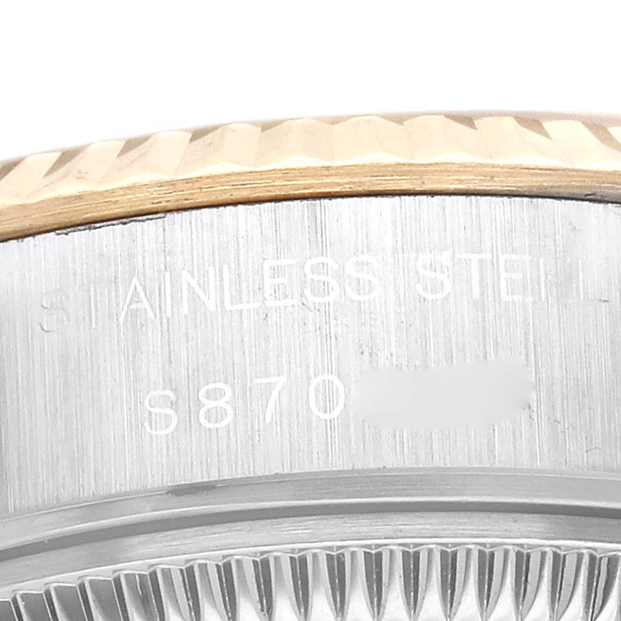 This image shows a close-up of the side case and fluted bezel of a Rolex Datejust 69173 Women's Steel and Gold (two tone) Champagne Dial 69173 Women's Steel and Gold (two tone) Champagne Dial in stainless steel.