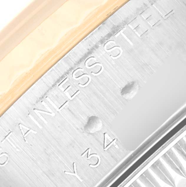 This image shows a close-up angle of the side engraving on a Rolex Datejust 79173 Women's Steel and Gold (two tone) Champagne Dial 79173 Women's Steel and Gold (two tone) Champagne Dial model, highlighting "STAINLESS STEEL."