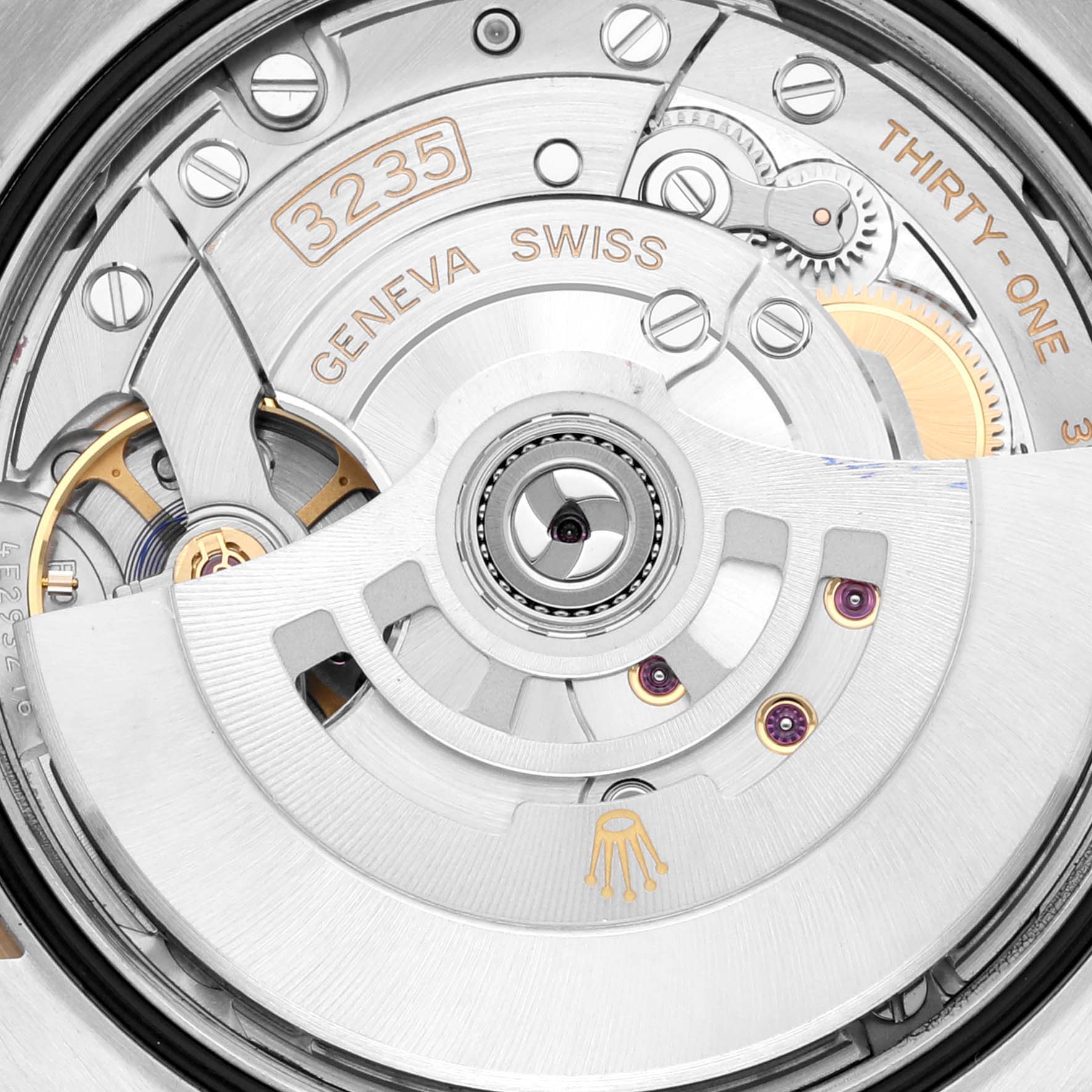 This image shows a close-up view of the movement mechanism in the Rolex Datejust 126233 Men's Steel and Gold (two tone) Champagne Dial 126233 Men's Steel and Gold (two tone) Champagne Dial watch model, specifically the 3235 caliber with Geneva Swiss markings.