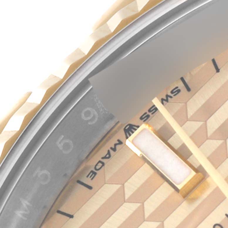 The image shows a close-up of the bezel, dial, and part of the hour hand of a Rolex Datejust 126233 Men's Steel and Gold (two tone) Champagne Dial 126233 Men's Steel and Gold (two tone) Champagne Dial watch.