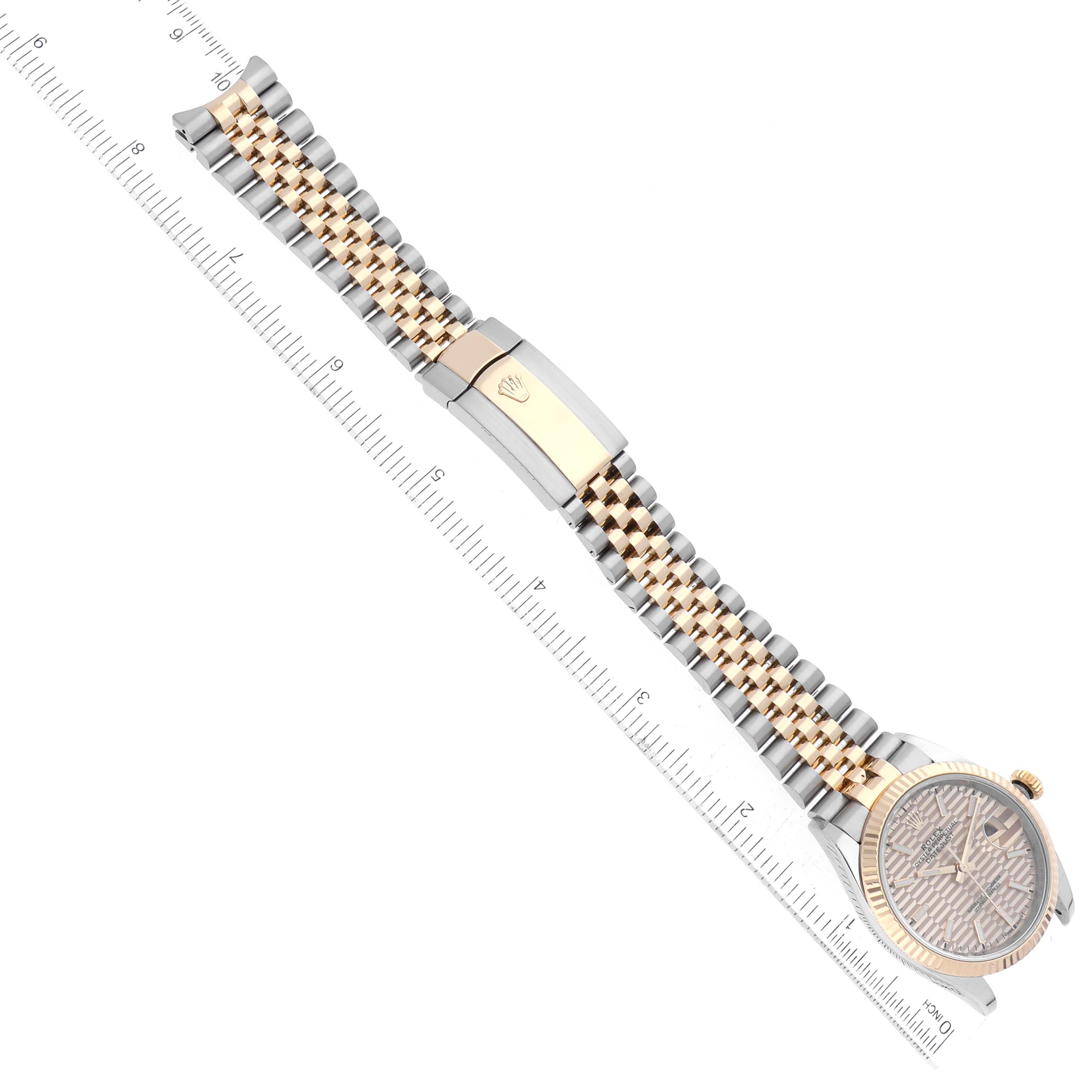 The image shows a top view of a Rolex Datejust 126233 Men's Steel and Gold (two tone) Champagne Dial 126233 Men's Steel and Gold (two tone) Champagne Dial model, featuring its jubilee bracelet, clasp, and dial.