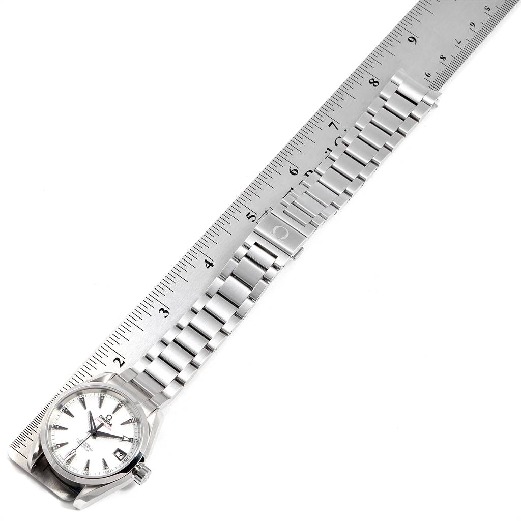 The image shows an Omega Aqua Terra 231.10.39.21.54.001 Men's Stainless Steel White Dial 231.10.39.21.54.001 Men's Stainless Steel White Dial model watch laid flat next to a ruler, displaying the full length of the watch including its face and bracelet.