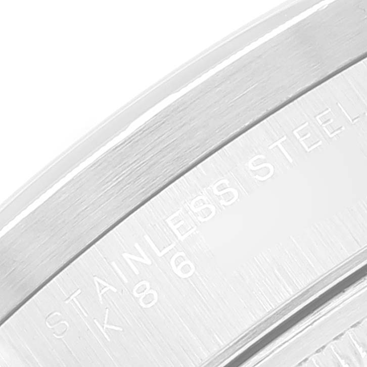 This is a close-up shot of the Rolex Date 15210 Men's Stainless Steel Black Dial 15210 Men's Stainless Steel Black Dial model's case back, showing the "STAINLESS STEEL" engraving.