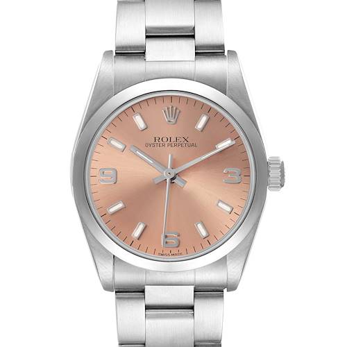 The Rolex Oyster Perpetual model 67480 is shown from a frontal angle, highlighting the dial, bezel, and part of the bracelet.