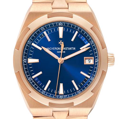 The Vacheron Constantin Overseas model 4500V is shown from a front angle, featuring a blue dial, date function at 3 o'clock, and a gold case and bracelet.