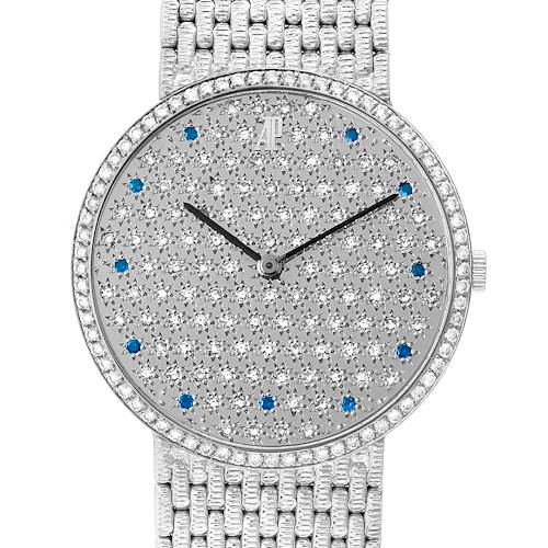 The image shows a front view of an Audemars Piguet Vintage Round White Gold Diamond Sapphire Ladies Watch, emphasizing its diamond-studded round dial and bracelet.