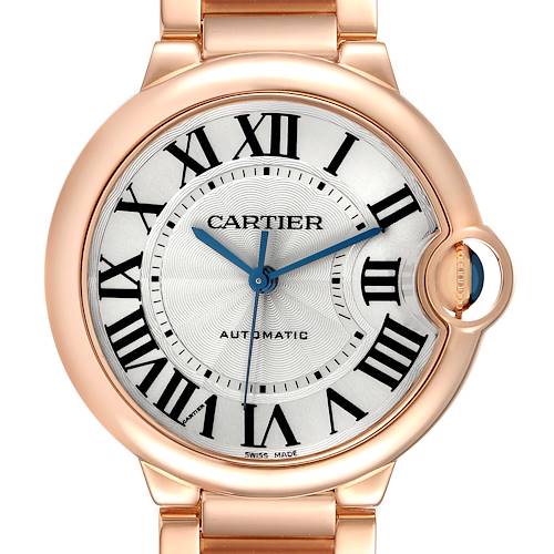 The Cartier Ballon Bleu model W69004Z2 watch is shown from a front angle, displaying its dial, Roman numerals, blue hands, and crown detail.
