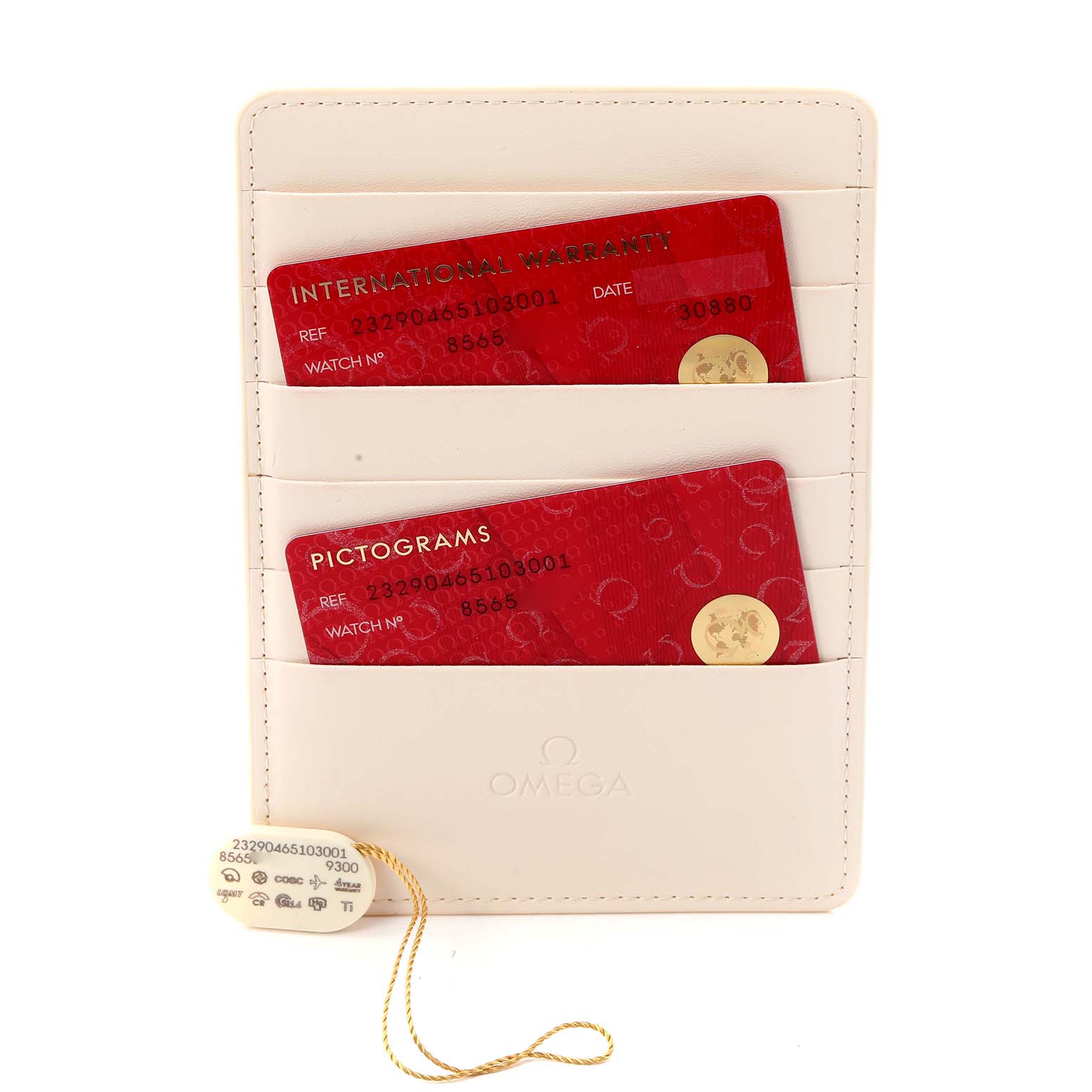 The image shows warranty and pictogram cards, along with a tag for the Omega Planet Ocean model 232.90.46.51.03.001, displayed in a cardholder.