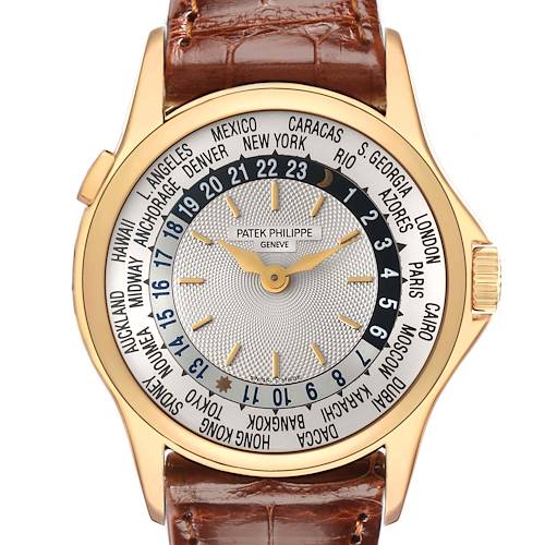 The image shows a front view of the Patek Philippe Complications model 5110J-001, highlighting its world time dial and brown leather strap.