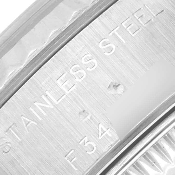 This image shows a close-up of the stainless steel engraving on the casing of a Rolex Datejust 79174 Women's Stainless Steel Silver Dial 79174 Women's Stainless Steel Silver Dial watch.