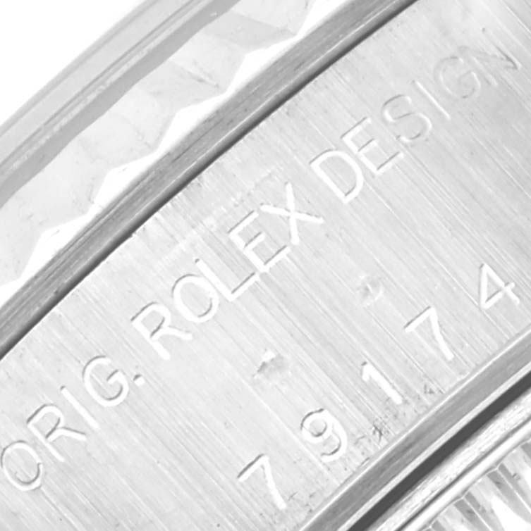 The image shows a close-up view of the side of a Rolex Datejust 79174 Women's Stainless Steel Silver Dial 79174 Women's Stainless Steel Silver Dial watch, highlighting the engraving "ORIG. ROLEX DESIGN" and the model number.