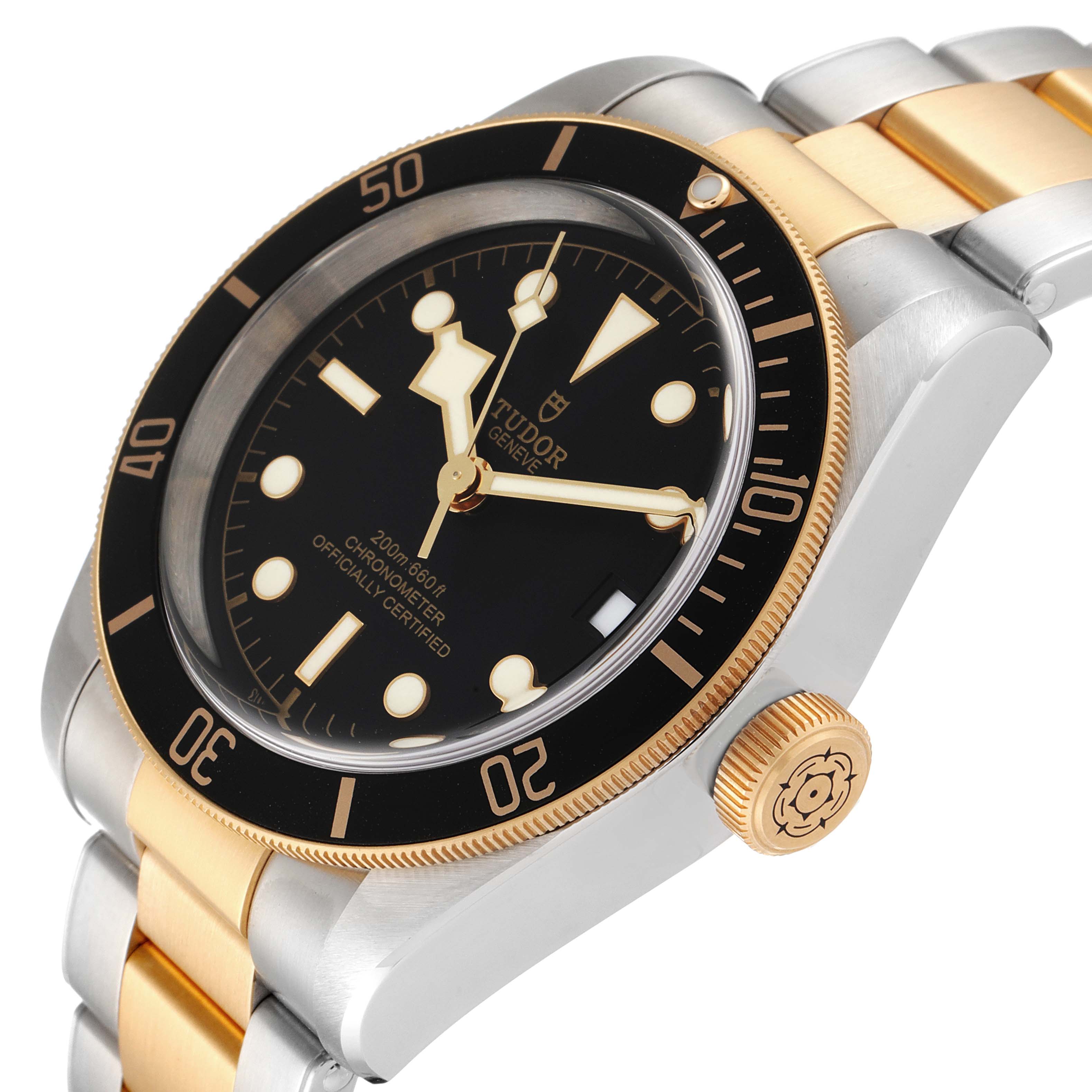 This image shows a Tudor Heritage Black Bay 79733 Men's Steel and Gold (two tone) Black Dial 79733 Men's Steel and Gold (two tone) Black Dial watch at an angled close-up, highlighting its bezel, dial, crown, and bracelet.