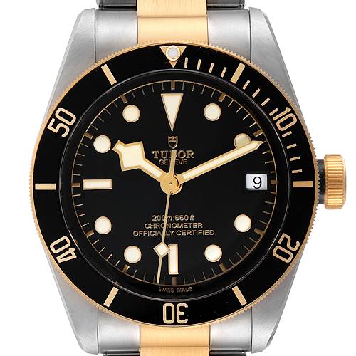 The image shows a close-up, front view of a Tudor Heritage Black Bay 79733 Men's Steel and Gold (two tone) Black Dial 79733 Men's Steel and Gold (two tone) Black Dial watch, highlighting its dial and bezel.